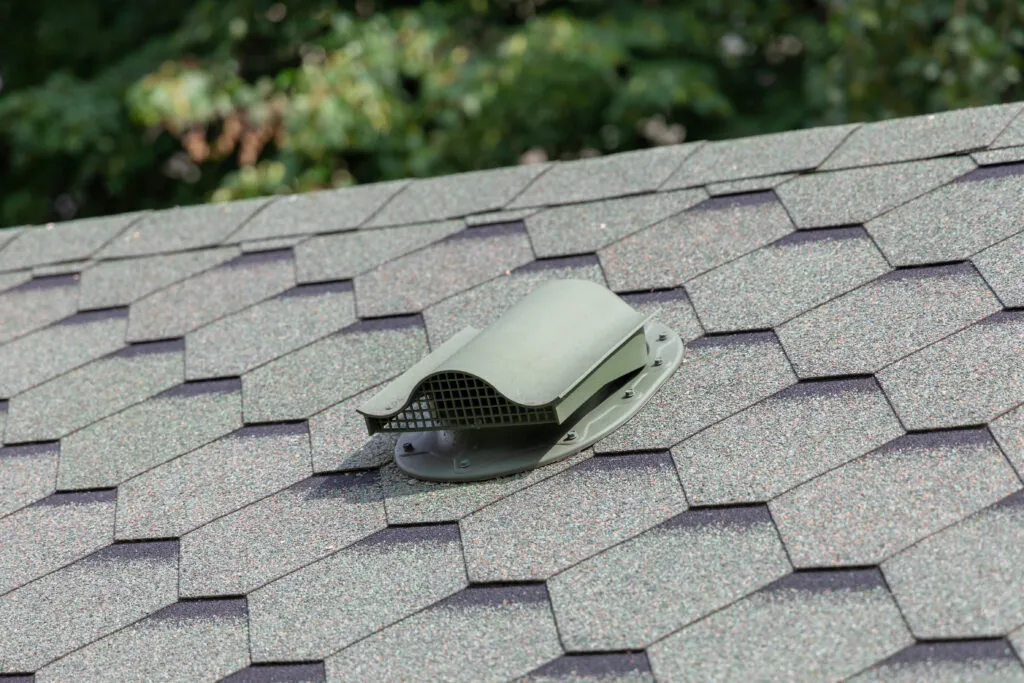 Green metal roof vent cap installation